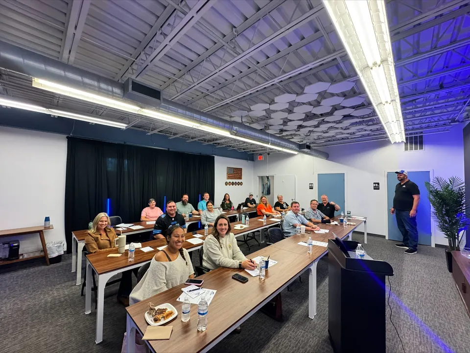 Local professionals gathered around classroom tables at a West Michigan Mortgage education event.